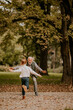 © BGStock72 - Grandfather spending time with his granddaughter in park on autumn day