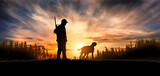 Fototapeta Konie - hunter with dog at sunset