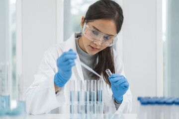 Scientist doing chemical test in research lab to study vaccine