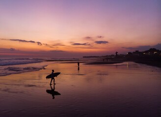 Wall Mural - Silhouette of a people on the beach at sunset in Canggu, Bali  Indonesia