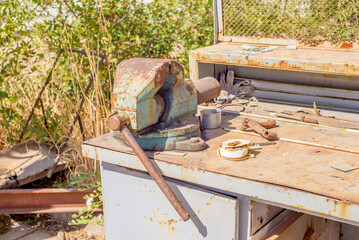 an old Soviet workbench stands in the sun