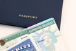 United States passport, social security card and permanent  resident (green) card on white background. Immigration concept
