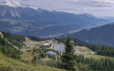 View of Rieteralm , Riteralm lake and the surroundings as seen from Gasselhohe summit (2001 m), located near Shladming, Schaladming-Dachstein, Styria, Austria