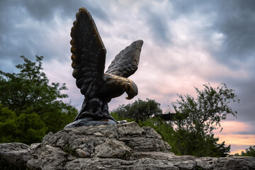 Wall Mural - Eagle statue at sunset, Pyatigorsk, Stavropol Krai, Russia. Historical landmark of Pyatigorsk installed in 1901