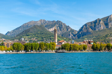 Wall Mural - View from the water of the cityscape skyline including the Campanile San Nicolo tower of the old town center of Lecco, Italy, on the shores of Lake Como.