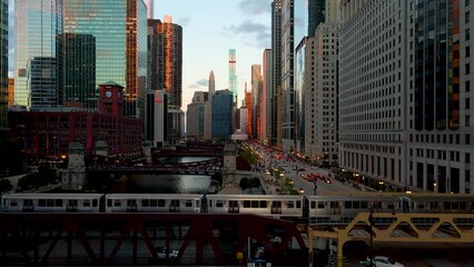 Wall Mural - Chicago, IL USA September 1 2022: establishing aerial drone footage of Chicago downtown during sunset on a mid summer evening. the contemporary buildings are beautiful to watch for tourist  