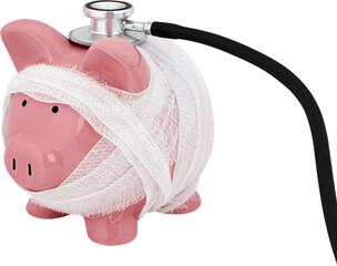 Wall Mural - Piggy bank wrapped in gauze with a stethoscope - financial check up concept