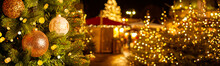 Christmas market at European town with christmas tree and lights, Evening time, blured, bokeh. Banner size.