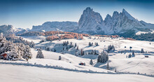 Christmas Postcard. Beautiful Winter View Of Alpe Di Siusi Ski Resort With Plattkofel Peak On Background. Spectacular Morning Scene Of Dolomite Alps, Ityaly, Europe. Untouched Winter Landscape..