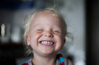 © Westend61 - Portrait of laughing little boy with closed eyes