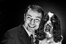 Portrait Of Mature Man With English Springer Spaniel, Smiling