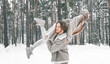 © velirina - Love romantic young couple. Guy spinning girl in snowy winter forest with trees. Walking, having fun, laughing in stylish clothes, fur coat,jacket, woolen shawl. Snow lovestory. Romantic date,weekend