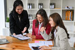 © bongkarn - Attractive Caucasian businesswoman in the meeting with her financial team