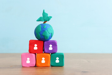 Concept image, stack of colorful cubes and globe. teamwork and connection idea