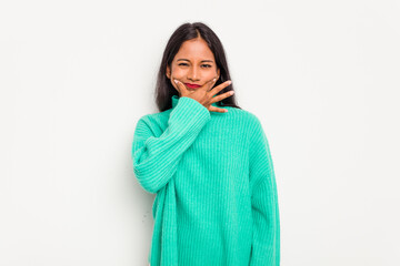 Young Indian woman isolated on white background doubting between two options.