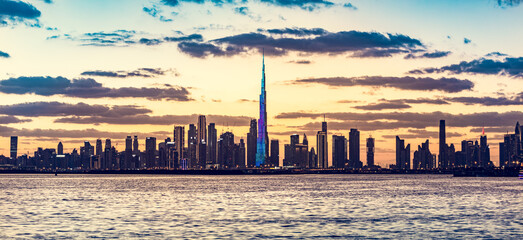 Skyscrapers skyline of Dubai UAE downtown with Burj Khalifa at sunset