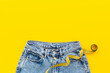 © 9dreamstudio - Yellow measuring tape into jeans as weight loss concept. Weight loss and diet concept