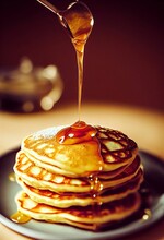 Vertical Shot Of Honey Pouring On Pancakes