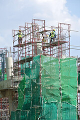 Wall Mural - JOHOR, MALAYSIA -APRIL 13, 2016: Scaffolding used as the temporary structure to support platform, form work and structure at the construction site. Also used it as a walking platform for workers. 
