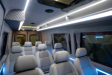 comfortable passenger bus interior with upholstered seats
