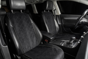 fabric seat cover in a car in a black interior