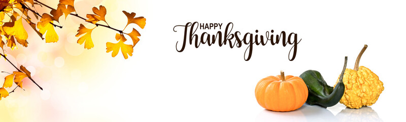 Wall Mural - happy thanksgiving header with ginkgo biloba yellow leaves and decorative pumpkins