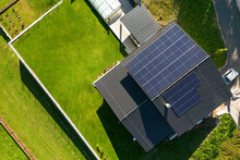 Top View Of Solar Photovoltaic Panels On Roof, Alternative Energy, Saving Resources And Sustainable Lifestyle Concept.