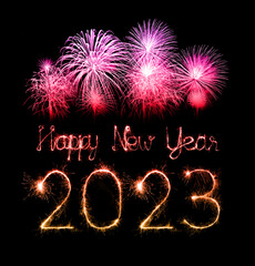 Wall Mural - 2023 happy new year fireworks celebration written sparkling at night.