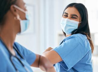 Poster - Covid, women and doctors elbow greeting in surgical mask at hospital or clinic during the pandemic. Teamwork, healthcare worker and medical professional with protection from virus for doctor or nurse