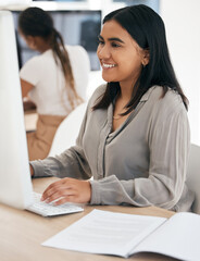 Wall Mural - Computer, report and typing with an indian woman in business working on a desktop in her office at work. Internet, email and desktop with a young female employee at work as a professional secretary