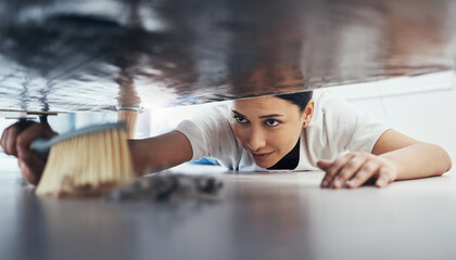 Canvas Print - Woman, hand broom or sweeping dust in house, home or hotel bedroom in housekeeping cleaning, cleaner service or hygiene maintenance. Brush, dirty or messy floor spring cleaning under hospitality sofa