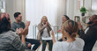 © Jordi P D/peopleimages.com - Group, clapping hands and counselling meeting for mental health, laugh and team happy, support and together in circle. Therapy session, depression and applause for breakthrough, motivation or talking