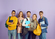 © Studio Romantic - Diverse group of happy university or college students. Cheerful smiling multiethnic young friends in casual wear with backpacks, laptop PCs and class textbooks standing in studio and looking at camera