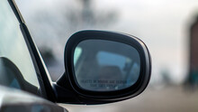 Rear View Mirror On A Black Car