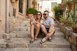 © Julija - Young hipster couple makes selfie portrait in the old town. Travel concept. Summer tourism.
