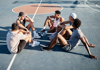 Wall Mural - Fitness, friends and relax on basketball court floor with basketball players group bond, resting and talking on a break. Sports, resting and men sitting on the ground at outdoor court after training