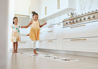 Poster - Hopscotch, fun and children playing a game together in the kitchen of their modern family home. Happy, smile and girl kids or sisters jumping on numbers to play, bond and for entertainment at a house