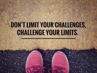 Wall Mural - Motivational and inspirational wording. “Don’t Limit Your Challenges, Challenge Your Limits” written on blurred vintage background.