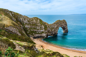 Sticker - Durdle Door on the Jurassic Coast in Dorset, England, UK; seascape natural landscape with rocks and while cliffs on the beach