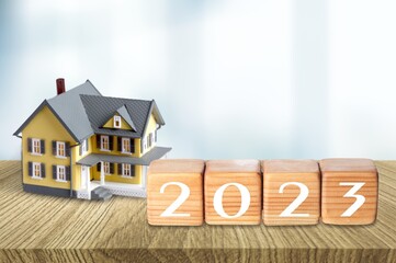 Poster - Small toy house and 2023 numbers on the desk