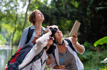 Backpack Tourist Travel Outdoor Adventure Bird Study Using Binoculars Looking And Record To Book