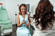 © Dusko - Audiologist doing impedance audiometry or diagnosis of hearing impairment. An beautiful redhead adult woman getting an auditory test at a hearing clinic.