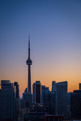 Wall Mural - Silhouette of Toronto skyscraper with beautiful sunset colors as background 