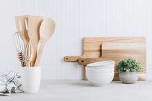 Kitchen Utensils. Kitchen Wooden Tools And Kitchenware. White Modern Kitchen Interior Background.