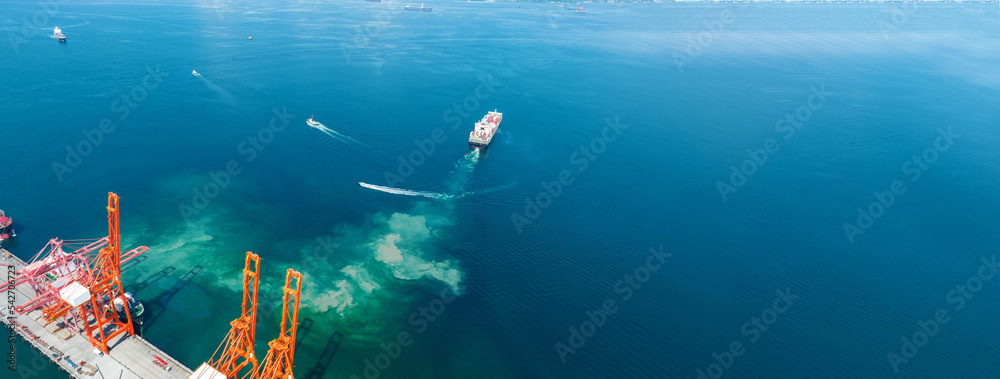 Cargo Container Ship Running Out from cargo Shipyard Bridge Container Sea Port logistics and transportation. International Shipping Depot Customs Port for import export trade Transport Business 