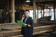 © Alan Kusuma - ASIAN YOUNG MAN BOSS OF WOOD COMPANY CALLING HER FRIEND AND CHECKING QUALITY
