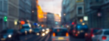 Blurred Urban Traffic In An Old City With Colorful Lights, Abstract Traffic Background Concept With Copy Space For Smart Cities, Electric Cars Or Urban Development