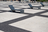 Fototapeta Londyn - Wroclaw square lined with concrete elements and benches. Summer.
