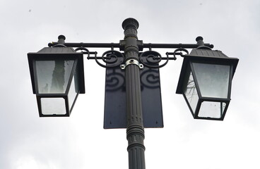 Street lamps on a background of cloudy sky in Romena in the comunne of Pratovecchio, Tuscany, Italy