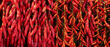 Red Chili Peppers Hanging In Spice Market. Banner